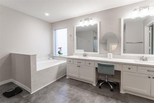 full bath with double vanity, a bath, a shower, and a textured ceiling