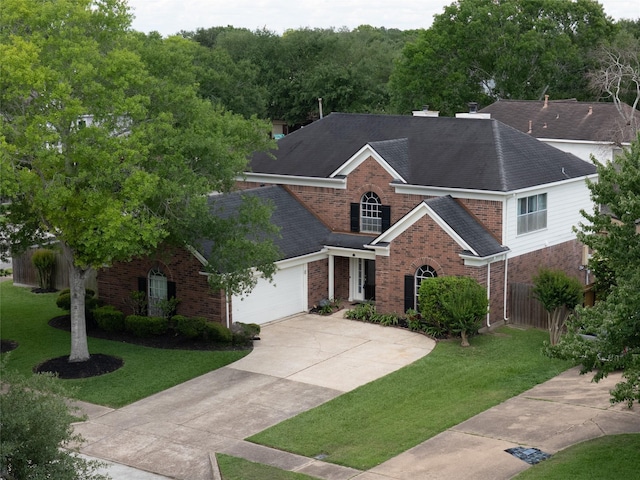 4001 Spring Branch Dr W, Pearland, TX 77584 - view of front of house featuring brick siding, a shingled roof, driveway, and a garage