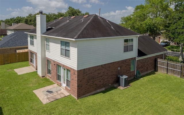 4001 Spring Branch Dr W, Pearland, TX 77584 - rear view of house with brick siding, a chimney, a patio, cooling unit, and roof with shingles
