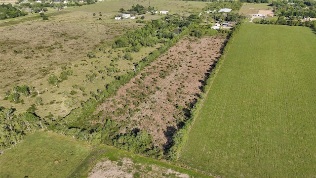 birds eye view of property with a rural view