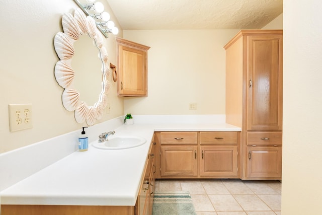 bathroom with tile patterned flooring and vanity