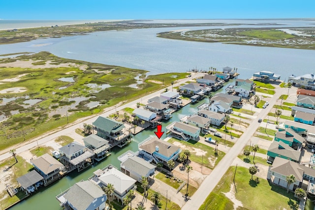 drone / aerial view featuring a water view and a residential view