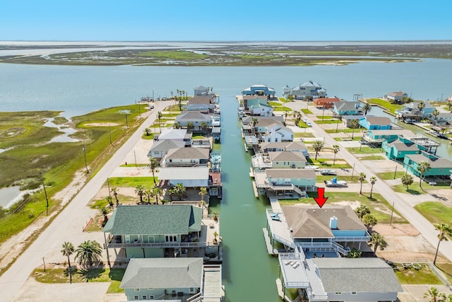 drone / aerial view featuring a water view and a residential view
