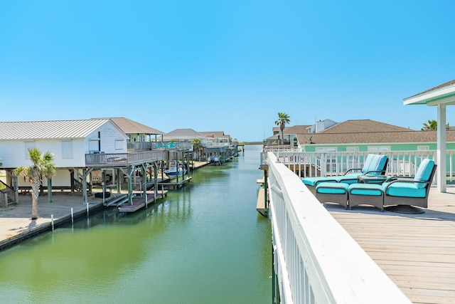 dock area with a water view and a residential view