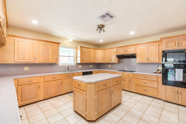 kitchen featuring visible vents, black appliances, under cabinet range hood, light countertops, and light brown cabinets