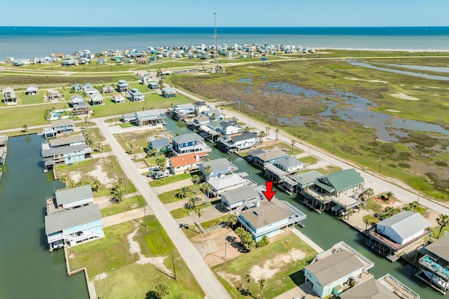 drone / aerial view featuring a water view and a residential view