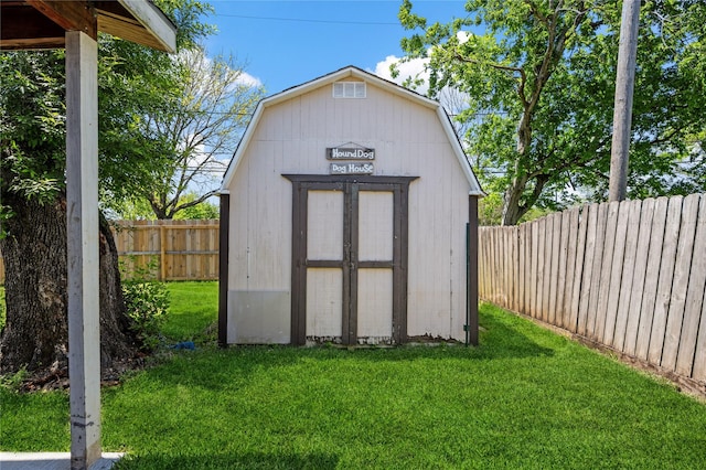 view of shed with a fenced backyard