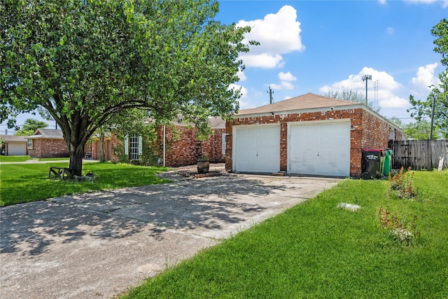 view of front of house with a garage, a front yard, brick siding, and fence