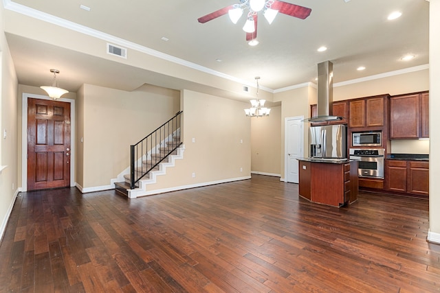 kitchen featuring a center island, dark countertops, island range hood, appliances with stainless steel finishes, and visible vents