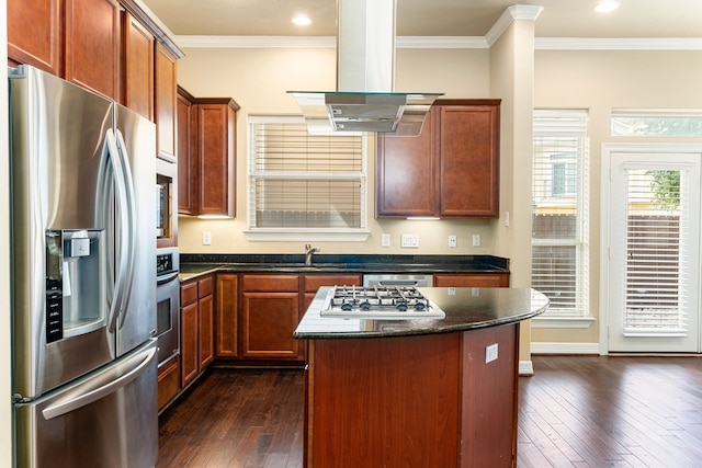 kitchen featuring dark wood-style flooring, ornamental molding, stainless steel appliances, and a sink