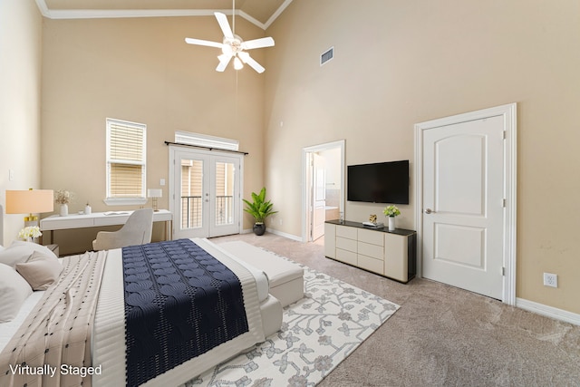 carpeted bedroom featuring visible vents, access to exterior, ornamental molding, french doors, and high vaulted ceiling