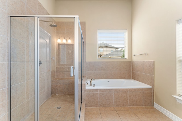 bathroom featuring a garden tub, tile patterned flooring, and a stall shower