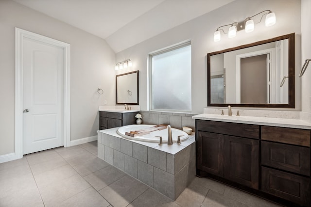 4290 Orchard Pass Dr, Spring, TX 77386 - full bathroom with baseboards, lofted ceiling, tile patterned floors, a bath, and two vanities