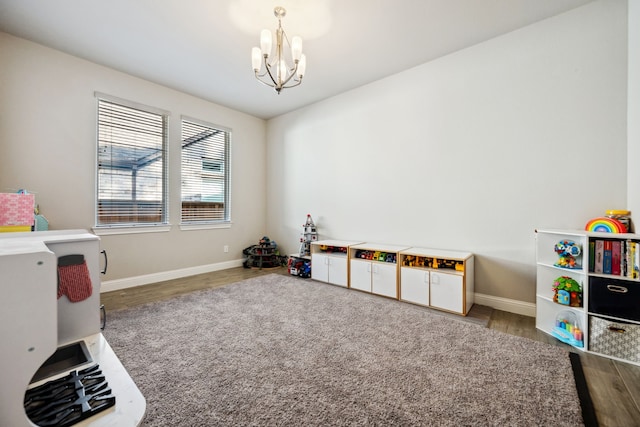 4290 Orchard Pass Dr, Spring, TX 77386 - playroom featuring a chandelier, wood finished floors, and baseboards