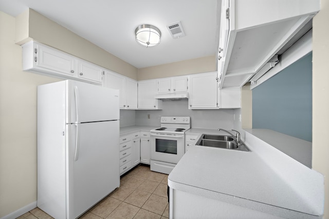 kitchen featuring a sink, visible vents, light countertops, under cabinet range hood, and white appliances