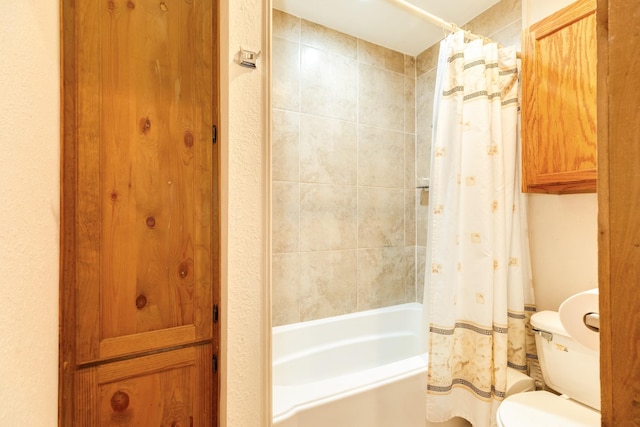 bathroom with toilet and shower / bathtub combination with curtain