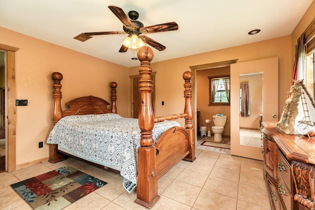 bedroom featuring a ceiling fan, connected bathroom, light tile patterned floors, and multiple windows