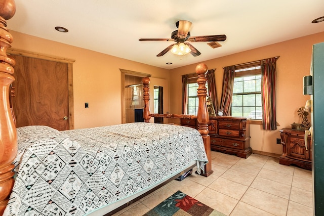 bedroom with visible vents, a ceiling fan, and light tile patterned floors