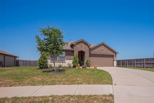 ranch-style house with a front yard, fence, brick siding, a garage, and concrete driveway