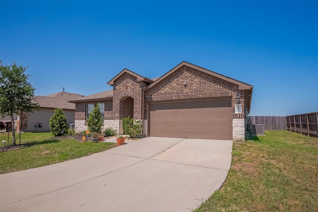 view of front of house featuring a front yard, an attached garage, fence, concrete driveway, and brick siding
