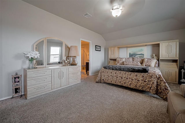 bedroom featuring light colored carpet, baseboards, vaulted ceiling, and visible vents