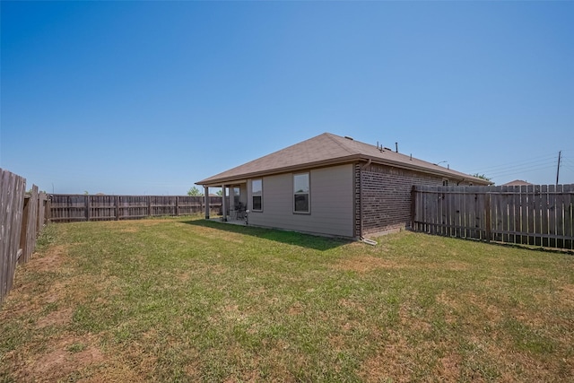 view of yard featuring a fenced backyard