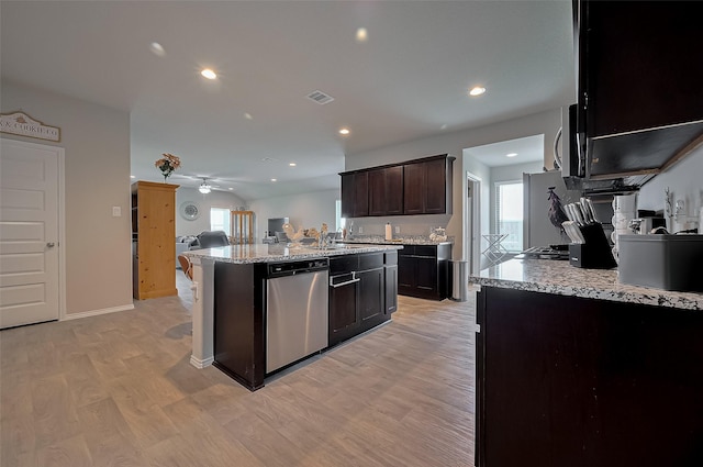kitchen with ceiling fan, light wood-type flooring, visible vents, stainless steel appliances, and open floor plan