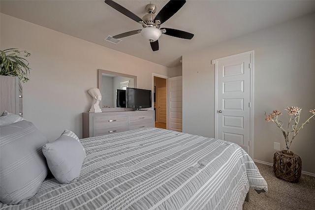 bedroom with carpet, visible vents, baseboards, and a ceiling fan
