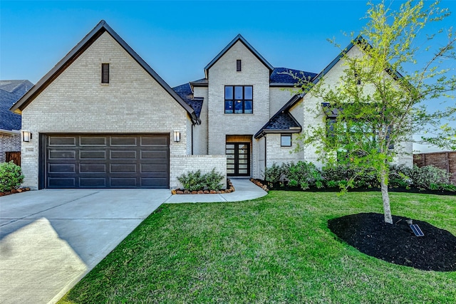 7606 Redwoods Forest Dr, Katy, TX 77493 - view of front of property with brick siding, a front lawn, a garage, and driveway
