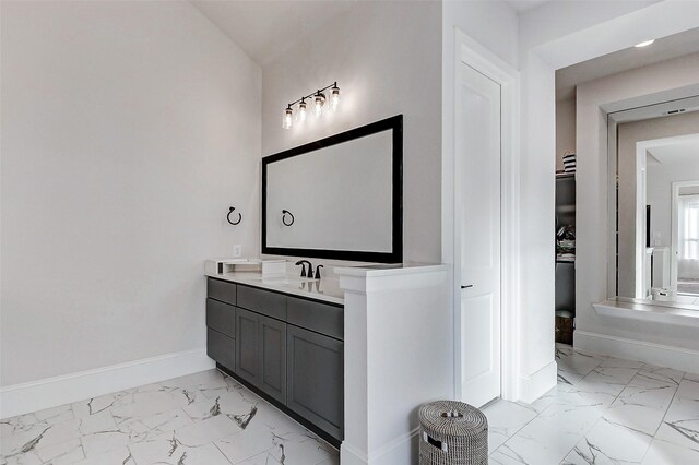 7606 Redwoods Forest Dr, Katy, TX 77493 - bathroom with vanity, marble finish floor, and baseboards