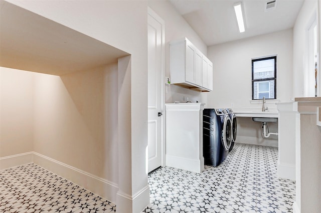 7606 Redwoods Forest Dr, Katy, TX 77493 - laundry room with light floors, visible vents, washing machine and dryer, a sink, and cabinet space