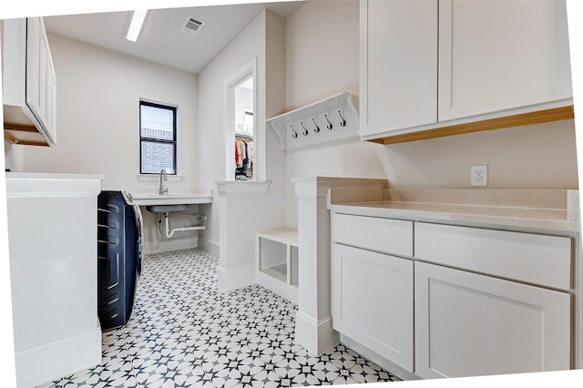 7606 Redwoods Forest Dr, Katy, TX 77493 - interior space featuring visible vents, baseboards, a sink, and light floors
