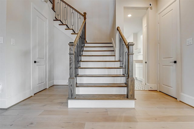 7606 Redwoods Forest Dr, Katy, TX 77493 - stairs featuring baseboards, recessed lighting, and wood finished floors