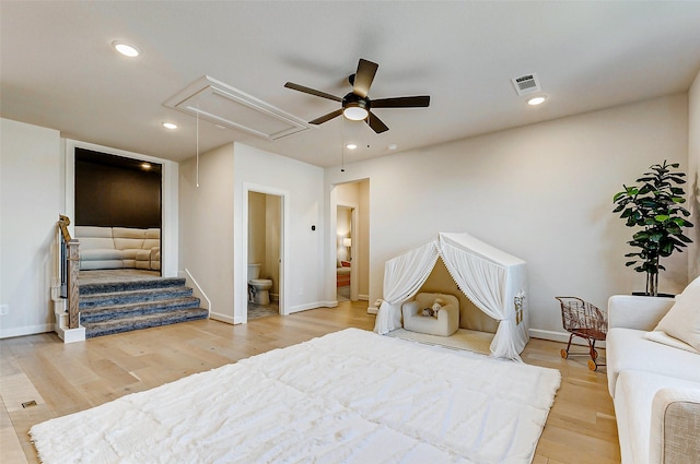 7606 Redwoods Forest Dr, Katy, TX 77493 - bedroom with visible vents, baseboards, attic access, and wood finished floors