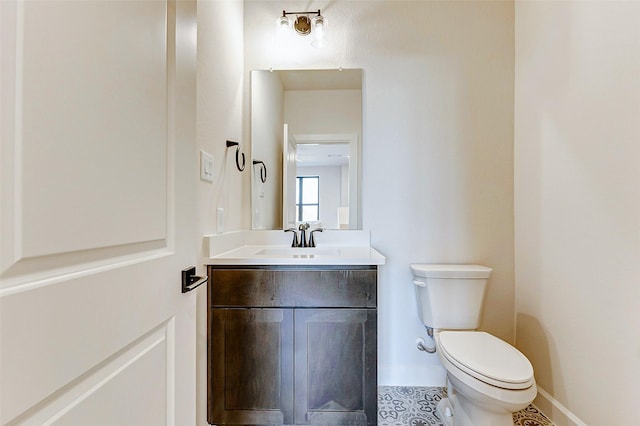 7606 Redwoods Forest Dr, Katy, TX 77493 - half bathroom with toilet, vanity, and baseboards