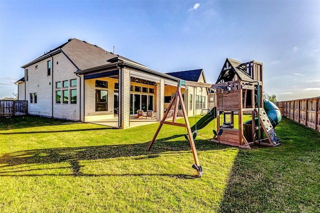 7606 Redwoods Forest Dr, Katy, TX 77493 - view of play area featuring a patio area, fence, and a lawn
