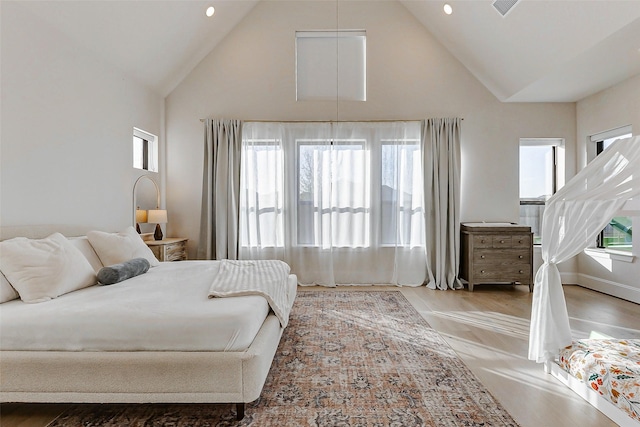 7606 Redwoods Forest Dr, Katy, TX 77493 - bedroom with high vaulted ceiling, recessed lighting, and wood finished floors
