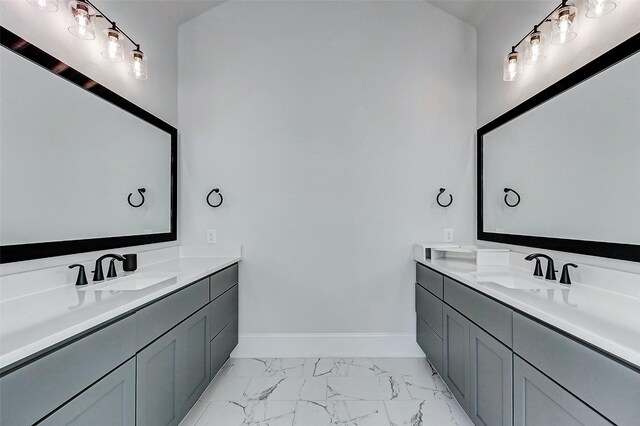 7606 Redwoods Forest Dr, Katy, TX 77493 - bathroom featuring baseboards, two vanities, marble finish floor, and a sink