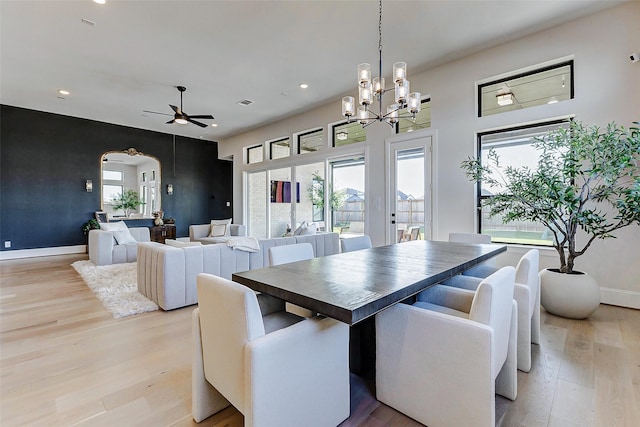 7606 Redwoods Forest Dr, Katy, TX 77493 - dining room featuring arched walkways, light wood-style floors, and a wealth of natural light