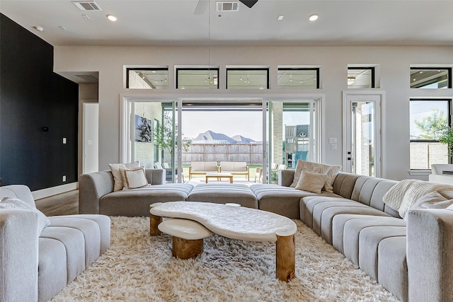 7606 Redwoods Forest Dr, Katy, TX 77493 - living area featuring visible vents, recessed lighting, wood finished floors, and a healthy amount of sunlight