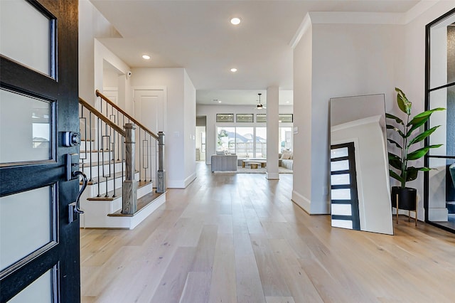 7606 Redwoods Forest Dr, Katy, TX 77493 - entryway featuring light wood-style flooring, recessed lighting, baseboards, and stairway