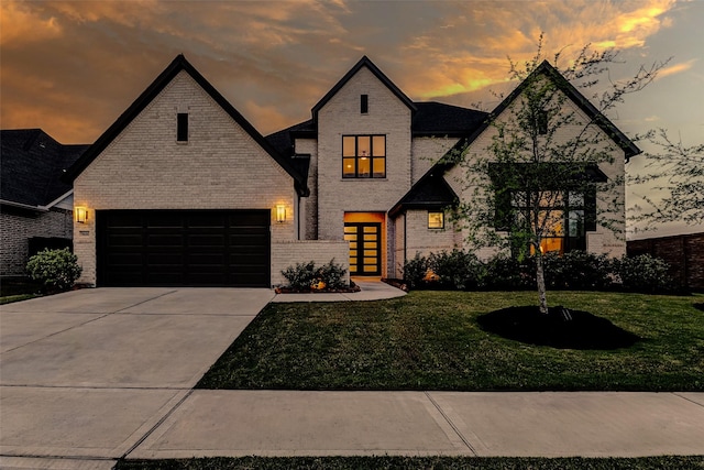 7606 Redwoods Forest Dr, Katy, TX 77493 - view of front of home featuring brick siding, driveway, and a lawn