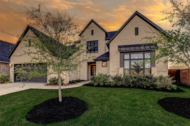7606 Redwoods Forest Dr, Katy, TX 77493 - view of front of home featuring fence, a front lawn, brick siding, an attached garage, and driveway