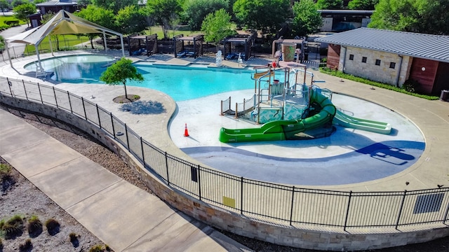 7606 Redwoods Forest Dr, Katy, TX 77493 - community pool featuring fence, a patio area, and a water play area