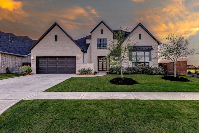 7606 Redwoods Forest Dr, Katy, TX 77493 - french provincial home with concrete driveway, a front yard, and brick siding
