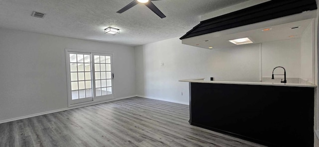 47 W Dansby Dr, Galveston, TX 77551 - bar with visible vents, baseboards, and wood finished floors