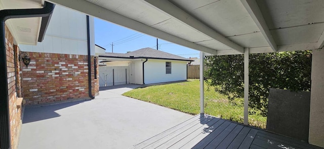 47 W Dansby Dr, Galveston, TX 77551 - wooden deck featuring a patio, a yard, and fence