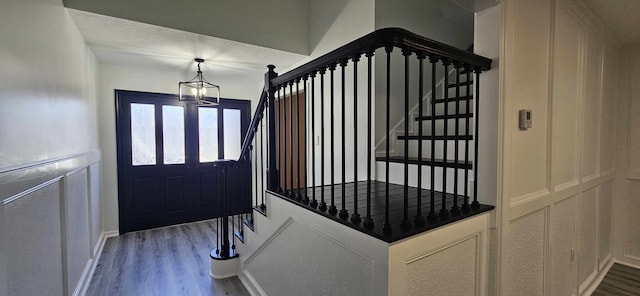 47 W Dansby Dr, Galveston, TX 77551 - foyer with a chandelier, stairway, dark wood-style flooring, and baseboards
