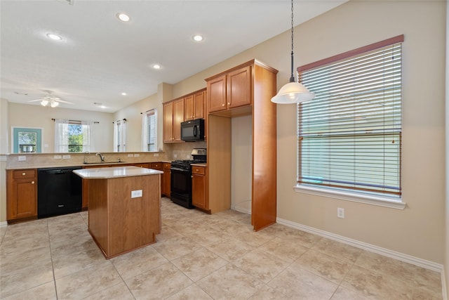 kitchen with tasteful backsplash, a center island, light countertops, ceiling fan, and black appliances