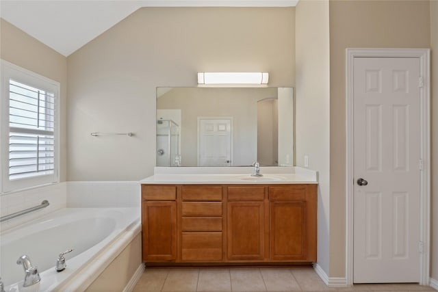 full bathroom with a garden tub, a shower stall, vanity, tile patterned flooring, and lofted ceiling
